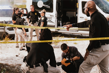 Detectives and crime scene investigators analyzing a crime scene