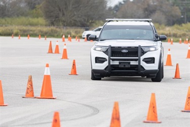 Police car driving through training track