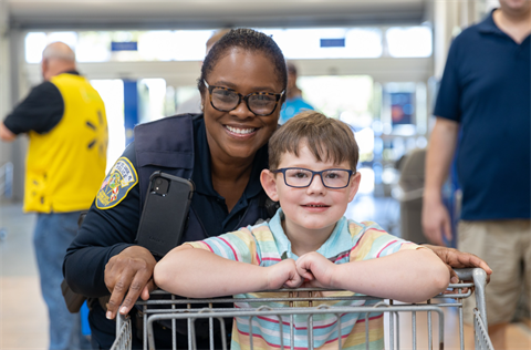 Shop with a cop officer and child